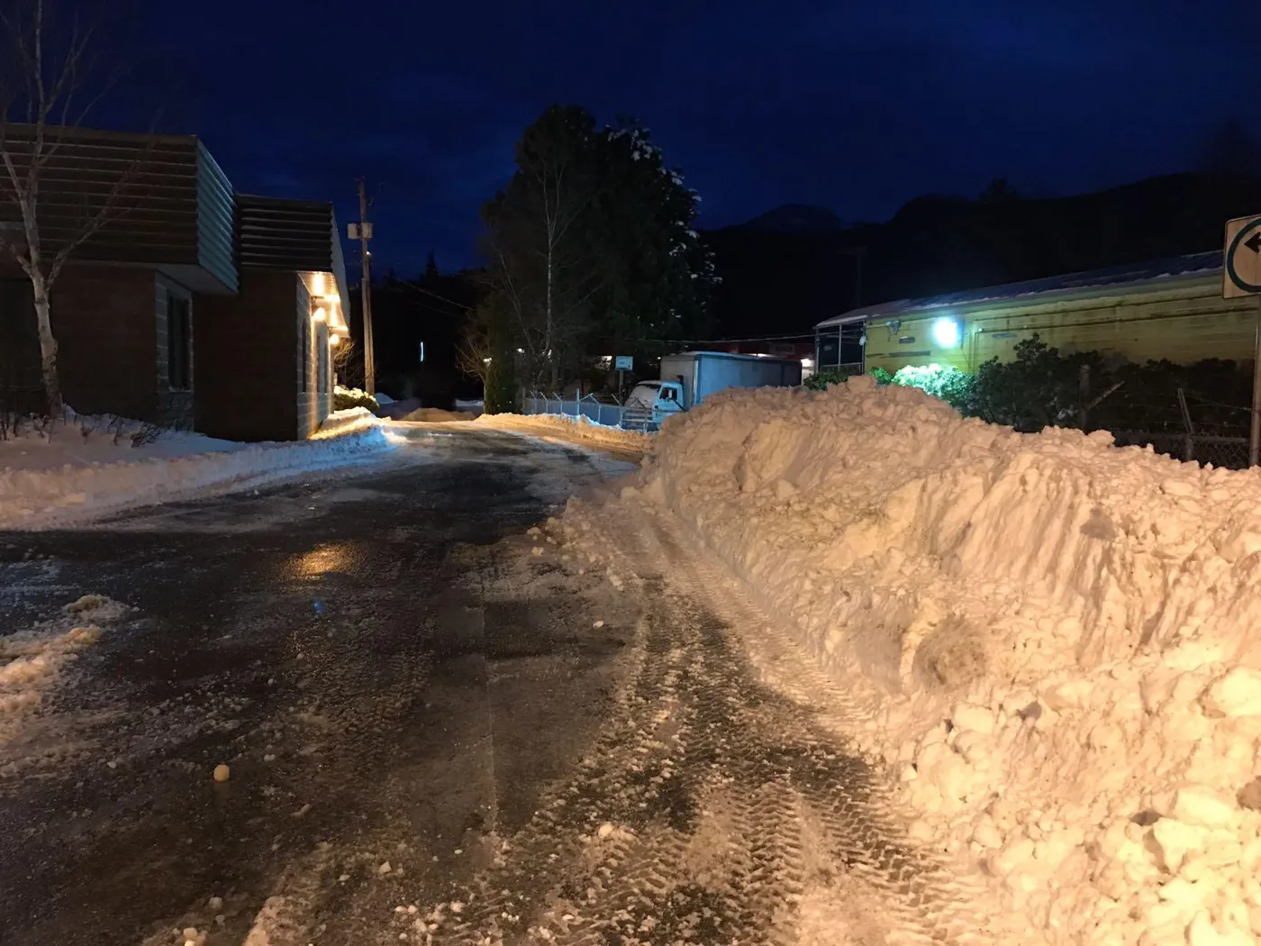 Snow pushed back along a commercial access lane